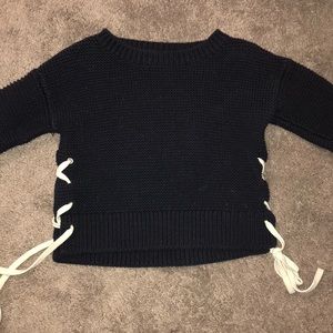 navy sweater with ties on the side